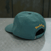 Gorra Deus Sentient green